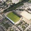 Oblique aerial view centred on the football stadium, taken from the NE.