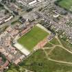 Oblique aerial view centred on the football ground, taken from the NNE.