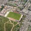 Oblique aerial view centred on the football ground, taken from the NW.