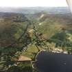 General oblique aerial view looking across Lochearnhead village and along Glen Ogle towards the Grampian mountains, taken from the SE.