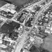 Oblique aerial view centred on town house from SE.