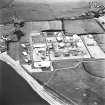 Oblique aerial view centred on chemical works from S.