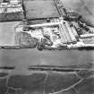 Oblique aerial view centred on boiler works from NE.