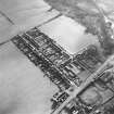 Oblique aerial view centred on miners' rows from NNE.