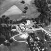 Oblique aerial view of country house from W.