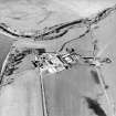 Oblique aerial view centred on the famsteading, taken from the SSW