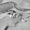 Oblique aerial view centred on the famsteading, taken from the SE