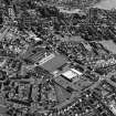 Oblique aerial view of Queen of the South F.C., Palmerston Park, taken from the NNW, centred on the football ground.