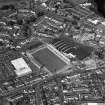 Oblique aerial view of Queen of the South F.C., Palmerston Park, taken from the SW, centred on the football ground.