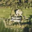 Oblique aerial view centred on the country house and stables, taken from the WNW.