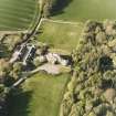 Oblique aerial view centred on the country house and stables, taken from the SSW.