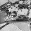 Oblique aerial view centred on the country house and garden, taken from the ENE.