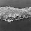 Oblique aerial view of Hestan Island, taken from E, centered on the lighthouse.