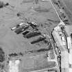 Oblique aerial view centred on Unit 2 of the explosives works and armament depot showing the production houses, air-raid shelters and canteen (S) and loading bank, taken from the WSW.
