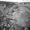 Oblique aerial view centred on the country house with tower-house and garden adjacent, taken from the WSW.