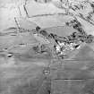 Oblique aerial view of Kirkcudbright training area centred on Girdstingwood Headquarters with buildings adjacent, taken from the SSW.