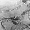 Oblique aerial view of Howwell Hill centred on tank sheds with rig adjacent, taken from the NE.