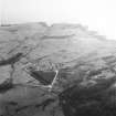 Oblique aerial view of Gypsy Point centred on the remains of field banks and rig with firing point and tracked target adjacent, taken from the N.