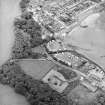 Oblique aerial view of the village, centred on the village hall, taken from the SE.