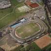 Oblique aerial view of Cowdenbeath centred on the Central Park football ground, taken from the SSW.
