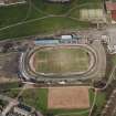 Oblique aerial view of Cowdenbeath centred on the Central Park football ground, taken from the SSE.
