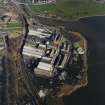 Oblique aerial view centred on the paper mill, taken from the SW.