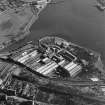 Oblique aerial view centred on the paper mill, taken from the NW.