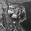 Oblique aerial view centred on the paper mill, taken from the WSW.