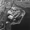 Oblique aerial view centred on the paper mill, taken from the SW.