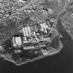 Oblique aerial view centred on the paper mill, taken from the SSE.