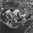 Oblique aerial view centred on the paper mill, taken from the ESE.