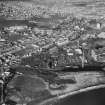 Aerial view from South of offshore construction yard and Methil.  Includes White Swan Hotel.