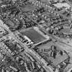 Oblique aerial view of Methil centred on East Fife football ground with Aberhill Primary School adjacent, taken from the E.