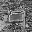 Oblique aerial view of Methil centred on East Fife football ground, taken from the NW.