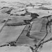 Oblique aerial view centred on the farmhouse with house adjacent, taken from the NE.