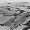 Oblique aerial view looking across house and farmhouse towards the Firth of Forth, taken from the NE.