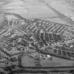 Oblique aerial view centred on Woodside housing estate in Glenrothes, taken from the WNW.