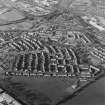 Oblique aerial view centred on Woodside housing estate in Glenrothes, taken from the SE.
