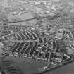 Oblique aerial view centred on Woodside housing estate in Glenrothes, taken from the SE.