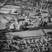 Oblique aerial view centred on the site of the works with the engineering works, foundry and offices, factory and works adjacent, taken from the SSE.