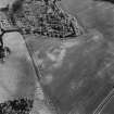 Dairsie Mill, oblique aerial view, taken from the N, centred on cropmarks, with a possible enclosure to the right of the photograph and the cropmarks of a ring-ditch, enclosures, a possible unenclosed settlement, and linear cropmarks to the bottom right of the photograph.