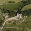 Dairsie Castle, oblique aerial view taken from the NW, centred on the remains of a castle, a church and Dairsie bridge.