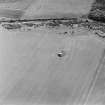 Oblique aerial view of Dunino Airfield centred on the remains of the control tower, taken from the WNW.