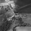 Oblique aerial view of Dairsie Castle and Dairsie Old Church centred on the castle and church, taken from the SE.