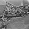 Oblique aerial view of the village of Kilrenny centred on the church, taken from the NE.