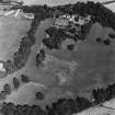 Myres Castle, oblique aerial view, taken from the SW, centred on the cropmarks of a fort. Myres Castle and Walled Garden are visible in the top centre of the photograph.