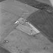 Oblique aerial view of Troy Wood centred on the radar station and military headquarters, taken from the ESE.
