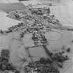 Oblique aerial view centred on the village of Upper Largo with walled garden and country house adjacent, taken from the NE.