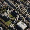 Oblique aerial view centred on the college and church, taken from the NW.