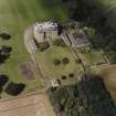 Oblique aerial view centred on the country house, garden, pavilions and lodges, taken from the SSE.